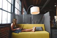 Girl on couch typing